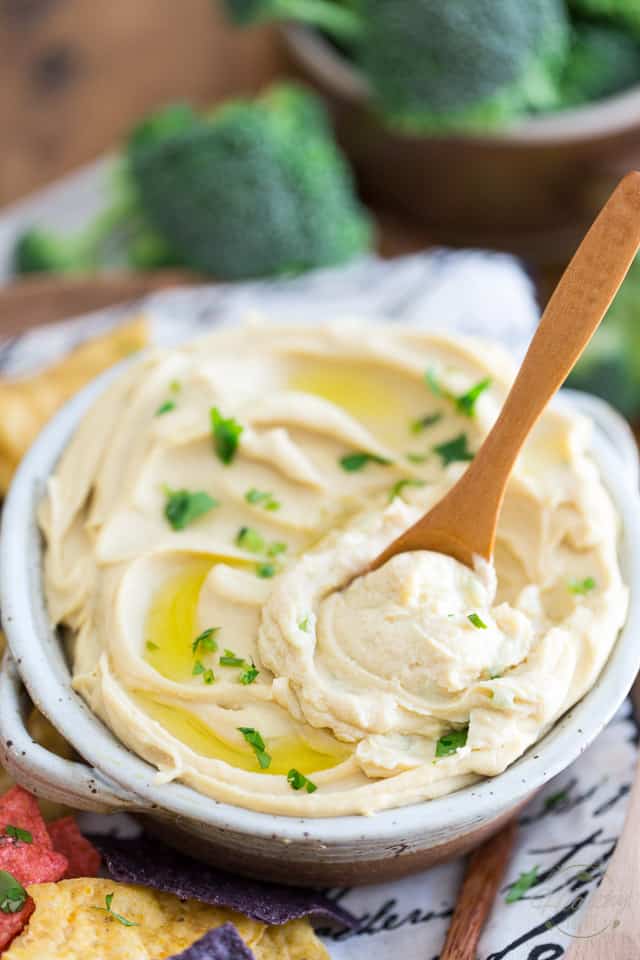 Learn the very simple trick to making the Smoothest and Creamiest Hummus ever. Hummus so good, you'll simply want to eat it by the spoonful!