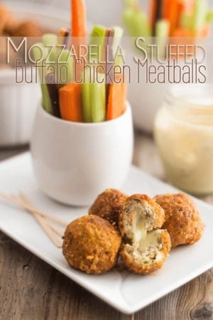 A gooey cheesy center in a tender meaty shell smothered in a picante Buffalo Sauce, these Mozzarella Stuffed Buffalo Chicken Meatballs are the ultimate Game Day Bites.