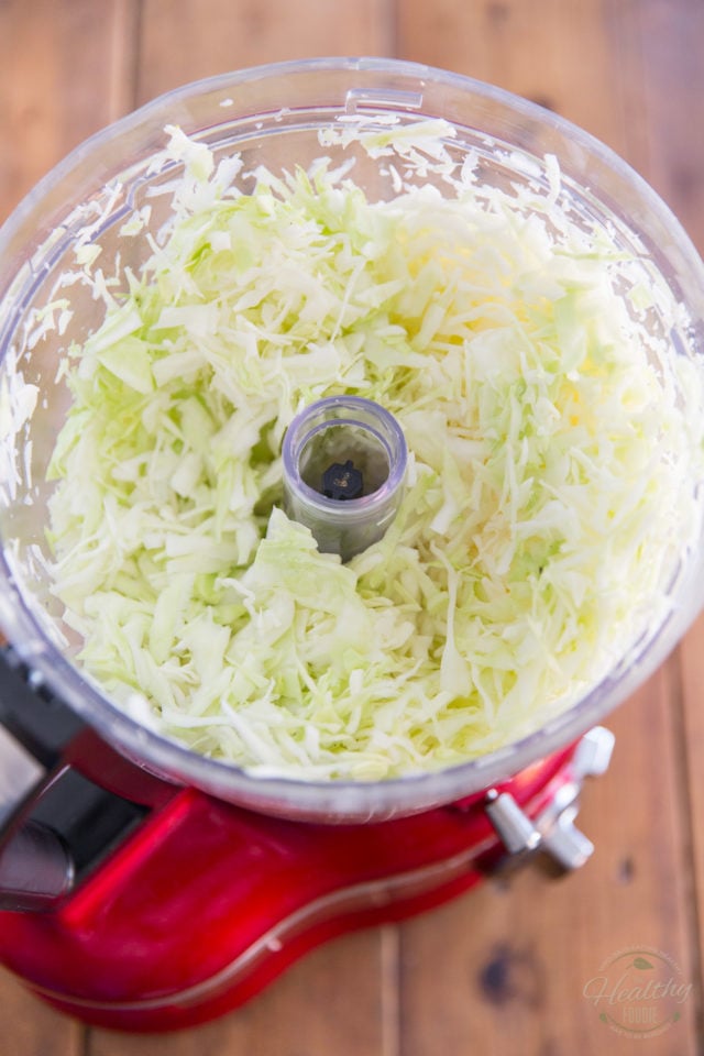 Shred the green cabbage thinly, preferably with the help of a food processor