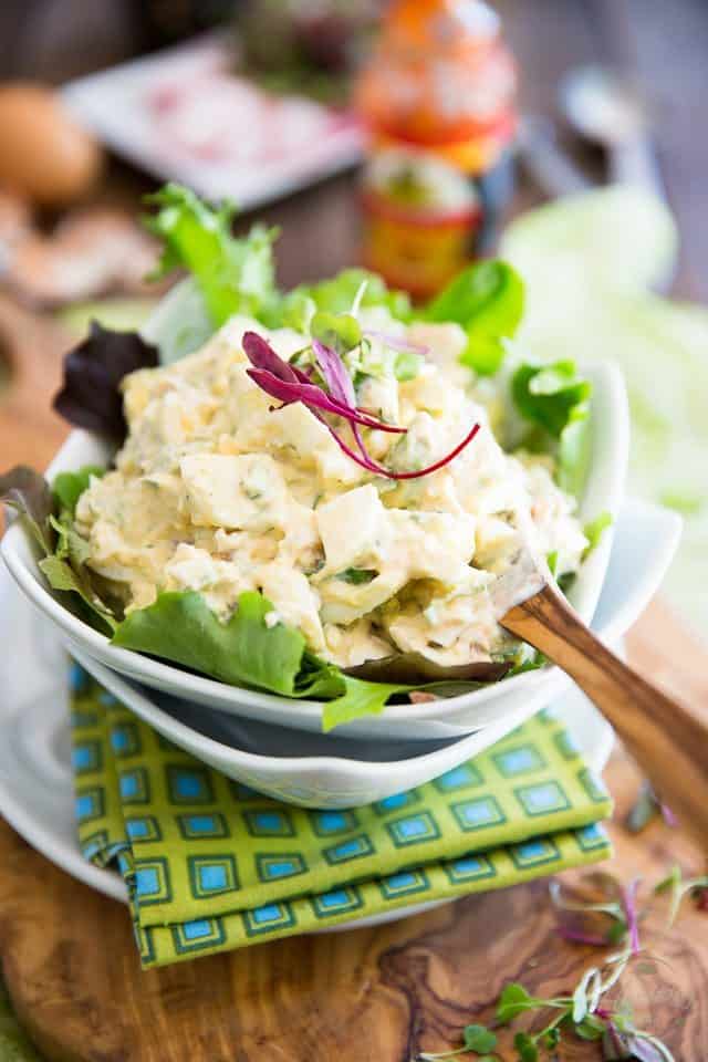 Hard boiled eggs and avocados are brilliantly brought together by yogurt and sour cream in this easy and delicious Avocado Egg Salad. Enjoy it as is or turn it into a nutritious sandwich!