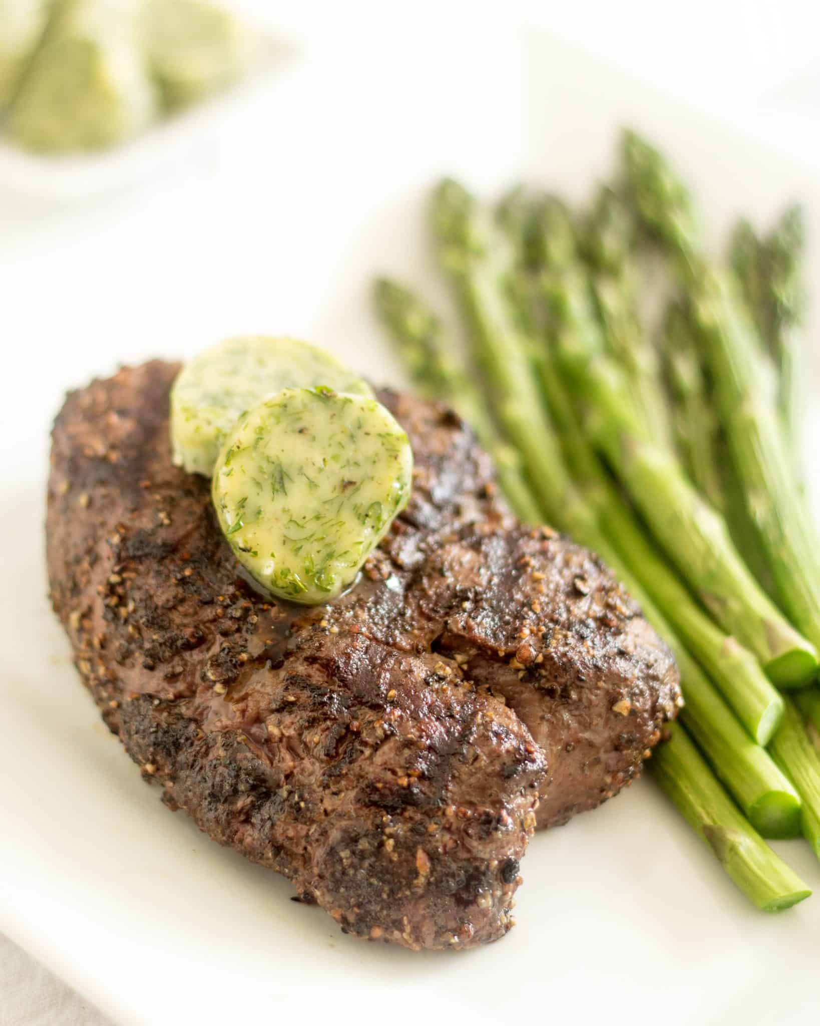 Steak made simple and elegant is what this dish is all about. The seasoned butter confers such a rich and buttery flavor to the meat, there’s no point in adding much of anything at all to it. A gentle kiss of the flame and a liberal amount of salt and pepper are all that are really needed here. 