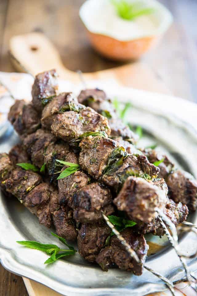 These lamb kabobs and tahini sauce harbor so much flavor, they totally belong on the menu of a 5 star restaurant! Learn how to make them super easily in the comfort of your own home. 