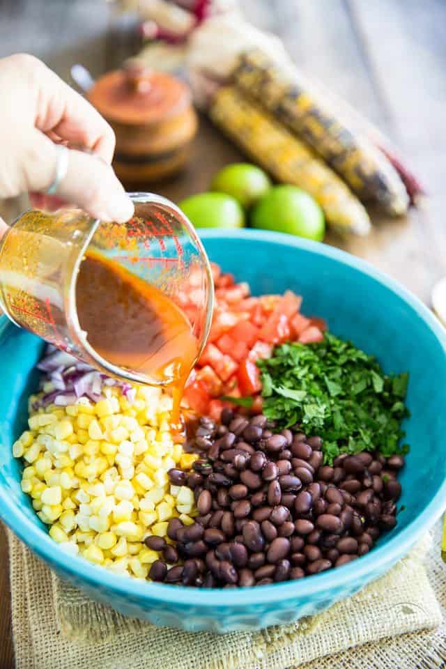 Bring on the maracas! This black bean and corn salad tastes just like a Mexican Fiesta is happening right inside your mouth! 