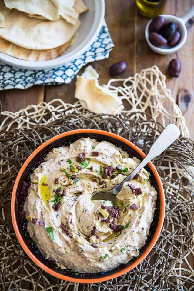 Quick to make and better than store-bought, this Olive Hummus will have you fall in love with the delicious chickpea spread all over again! 