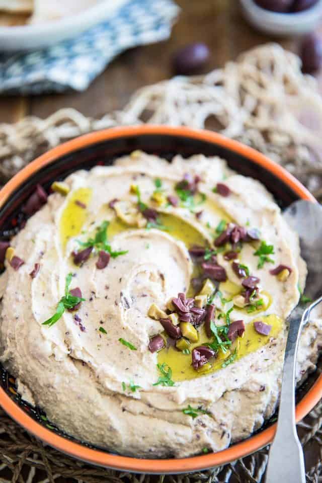 Quick to make and better than store-bought, this Olive Hummus will have you fall in love with the delicious chickpea spread all over again! 