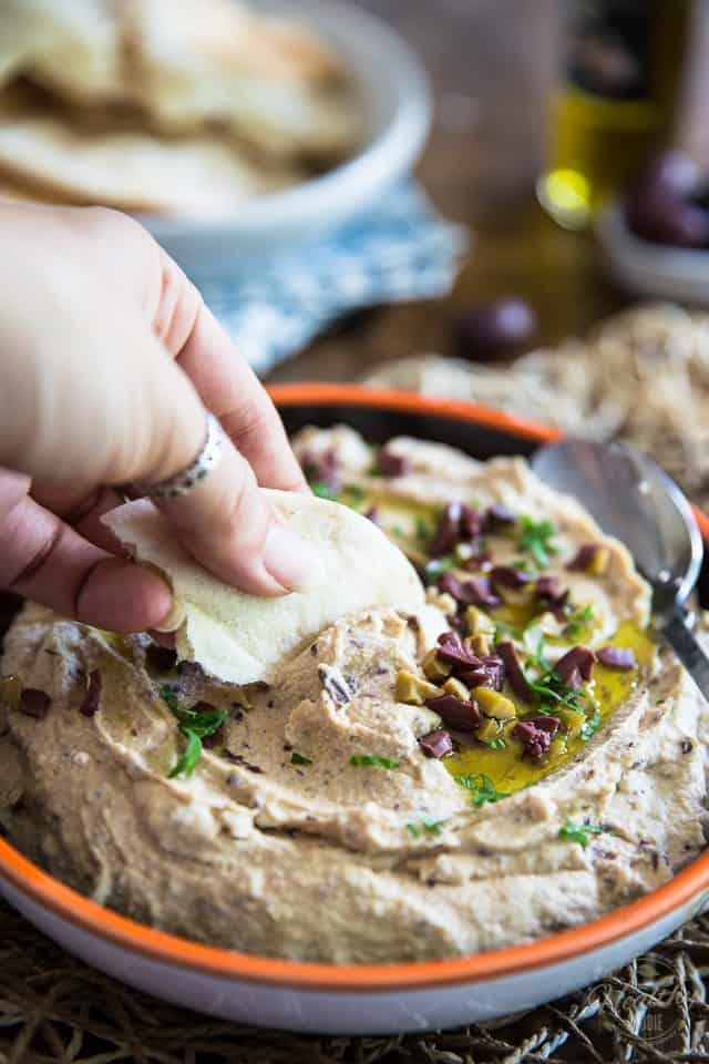 Quick to make and better than store-bought, this Olive Hummus will have you fall in love with the delicious chickpea spread all over again! 