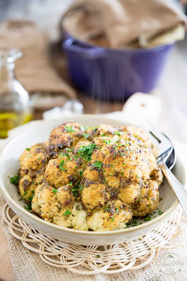 Oven Baked Whole Roasted Cauliflower is the easiest and tastiest way to prepare cauliflower. It'll make you an instant fan, guaranteed! 