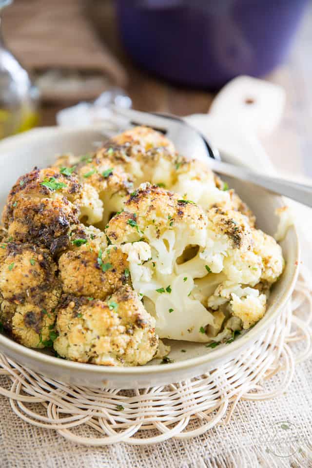 Oven Baked Whole Roasted Cauliflower is the easiest and tastiest way to prepare cauliflower. It'll make you an instant fan, guaranteed! 