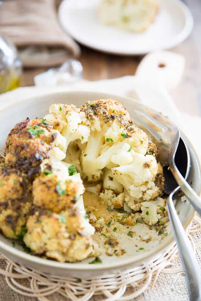 Oven Baked Whole Roasted Cauliflower is the easiest and tastiest way to prepare cauliflower. It'll make you an instant fan, guaranteed! 
