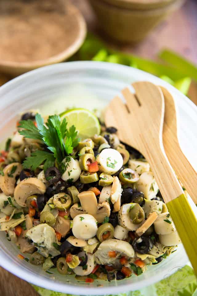 Love olives? Then you will be absolutely all over this Loaded Olive Salad. So quick and easy to make, too! Open cans, chop a few veggies, mix and enjoy!