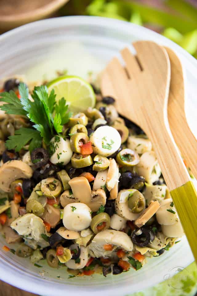 Love olives? Then you will be absolutely all over this Loaded Olive Salad. So quick and easy to make, too! Open cans, chop a few veggies, mix and enjoy!