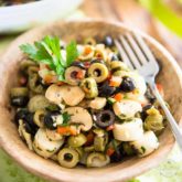 Love olives? Then you will be absolutely all over this Loaded Olive Salad. So quick and easy to make, too! Open cans, chop a few veggies, mix and enjoy!