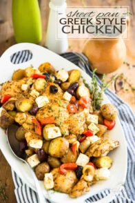 Sheet Pan Greek Style Chicken - Juicy pieces of chicken, roasted potatoes, olives, feta cheese, bell peppers and onions baked together in a single pan