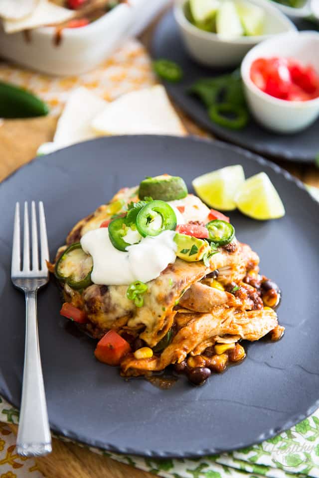 Chicken, corn, black beans, cheese and flour tortillas in a spicy enchilada sauce, healthy has never felt so indulgent as this Chicken Enchilada Casserole. 