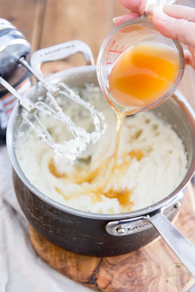 Adding chicken stock to the mashed potatoes