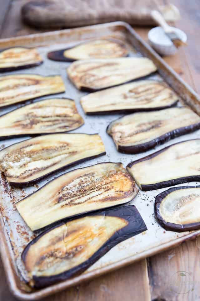 Eggplant slices baked in large baking sheet until softened and slightly golden