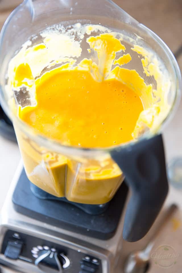 Cream of leek and sweet potato soup being processed in a vitamix high speed blender