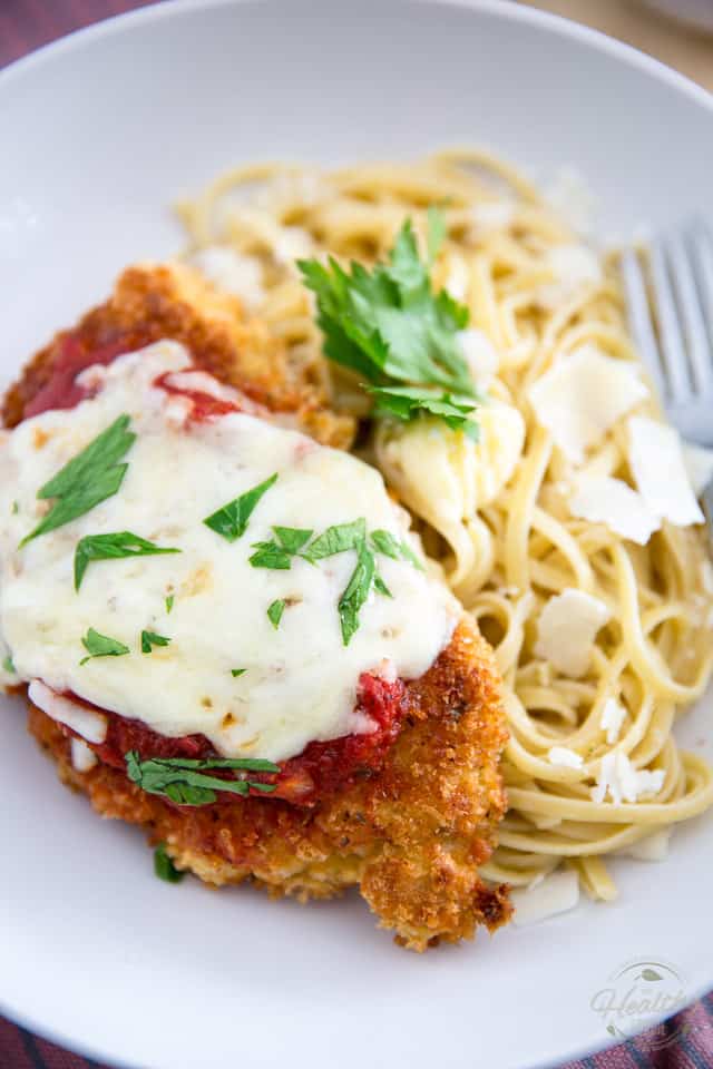This Chicken Parmigiana is proof that Comforting food doesn't necessarily have to be bad for you... serve it with a side of your favorite pasta to keep with the classic, or opt for sauteed veggies or a green salad for an even lighter version! 