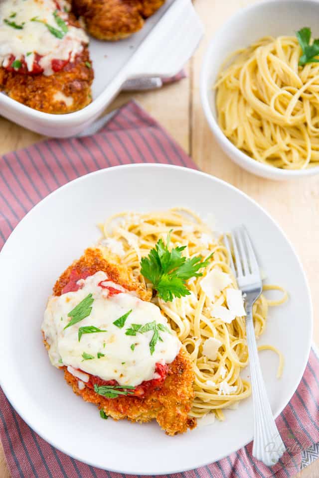 This Chicken Parmigiana is proof that Comforting food doesn't necessarily have to be bad for you... serve it with a side of your favorite pasta to keep with the classic, or opt for sauteed veggies or a green salad for an even lighter version! 