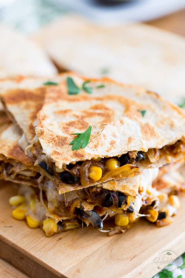 Super quick and easy to make, these healthier Chicken Quesadillas are loaded with chiken, corn, olives and just what it takes of cheese to bind it all together. With their explosion of Mexican flavors, kids and adults alike will love 'em! 