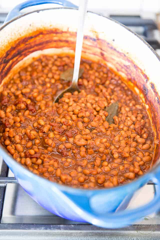 Old Fashioned Baked Beans in a blue Dutch oven after 5 hours of baking time