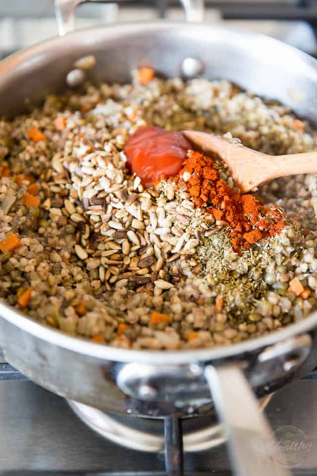 Spices are getting mixed into cooked lentils and kasha in a saute pan