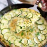 As delicious as it is easy to make, this Cheesy Zucchini Frittata is so moist, so fluffy, so crazy tasty, it's guaranteed to win you over, even if you're not a fan of omelets!