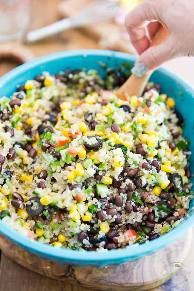 Inspired by my favorite Lebanese restaurant, this extremely simple but super tasty Black Bean Corn and Quinoa Salad goes good with just about anything and is just as enjoyable any time of the year! 