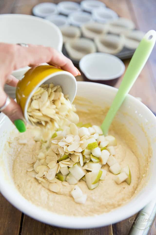 Pears and almonds are being added to muffin batter