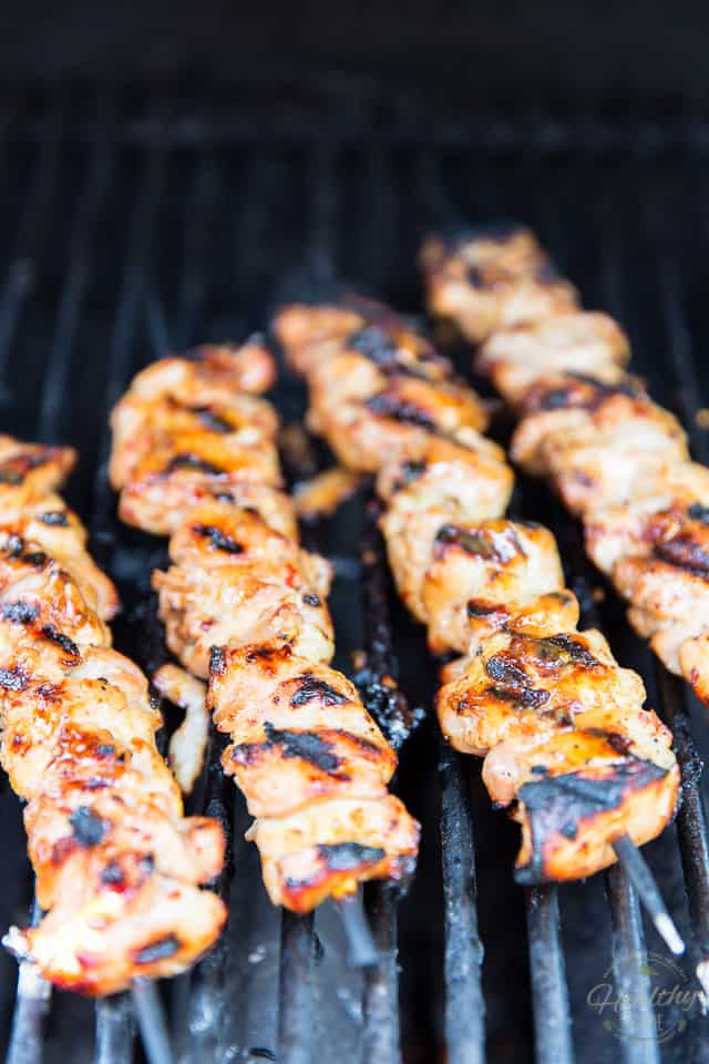 Chicken Skewers grilling on an outdoor grill
