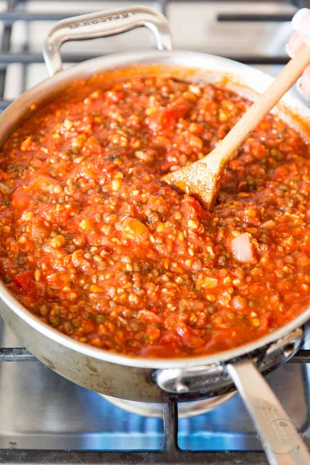 Lentil and tomato sauce simmering in large saute pan