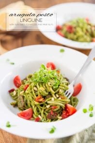 Arugula Pesto is a very decent, super tasty and much more affordable alternative to traditional basil pesto! Served with pasta, paired with sun dried tomatoes and pine nuts, it makes for a truly winning combination.