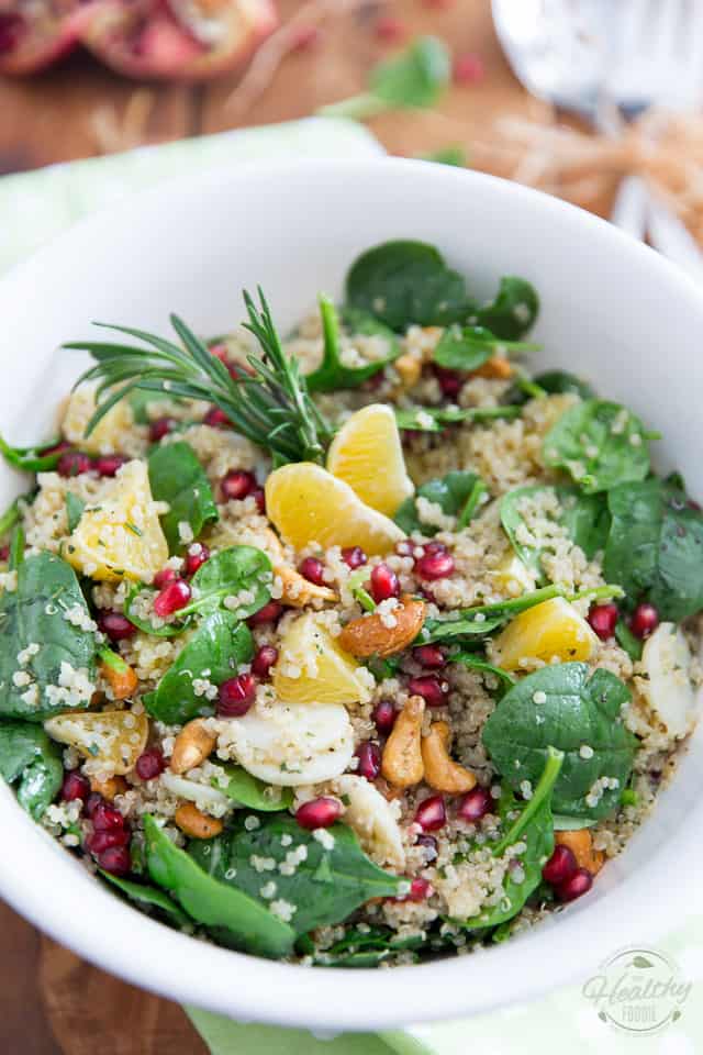 This Spinach Quinoa Salad with cashews, orange, water chestnuts and pomegranate seeds is so pretty and tasty, it'll have no trouble finding a spot on your Christmas menu... but really, no need to save it for the occasion: it's just as spectacular any other day of the year!