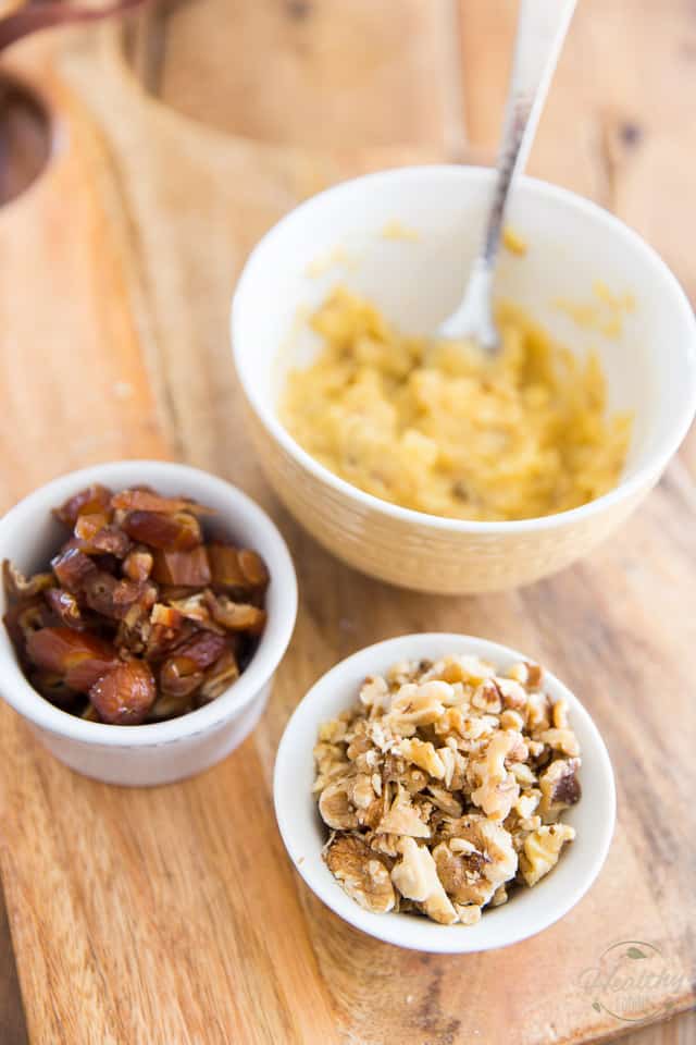 Mashed bananas, chopped dates and walnuts in white bowls