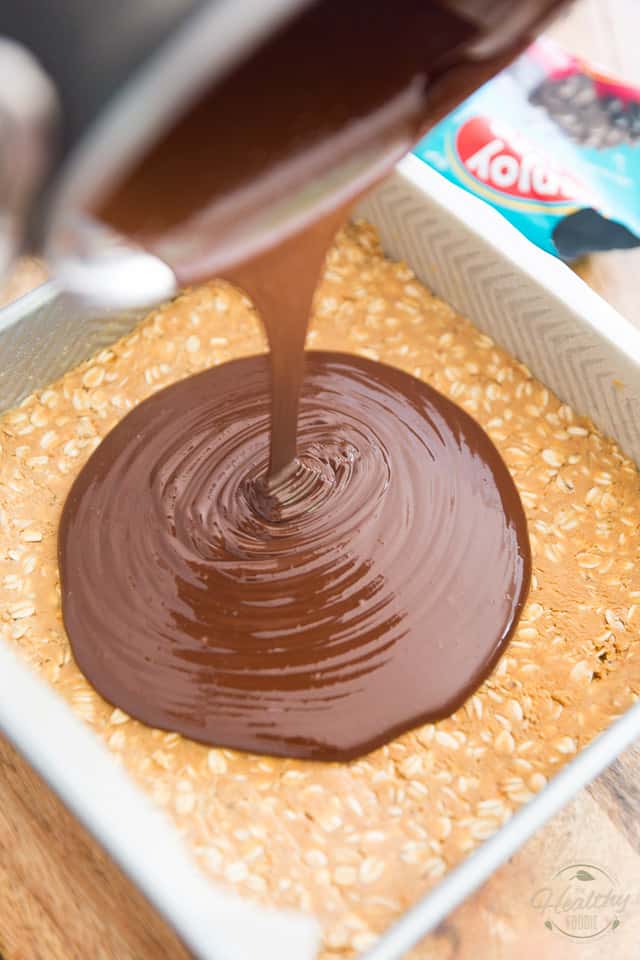 Pour the chocolate peanut butter mixture over the reserved peanut butter oatmeal base