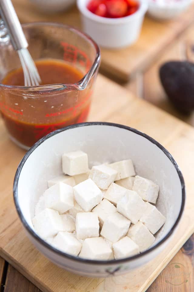 Cut the tofu into cubes and coat in tapioca starch