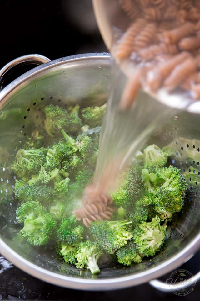 When the pasta is cooked, pour it along with its cooking water over the broccoli