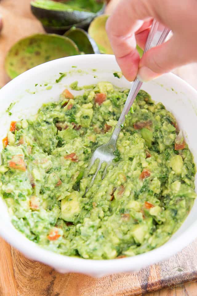 Mash the avocados with a fork