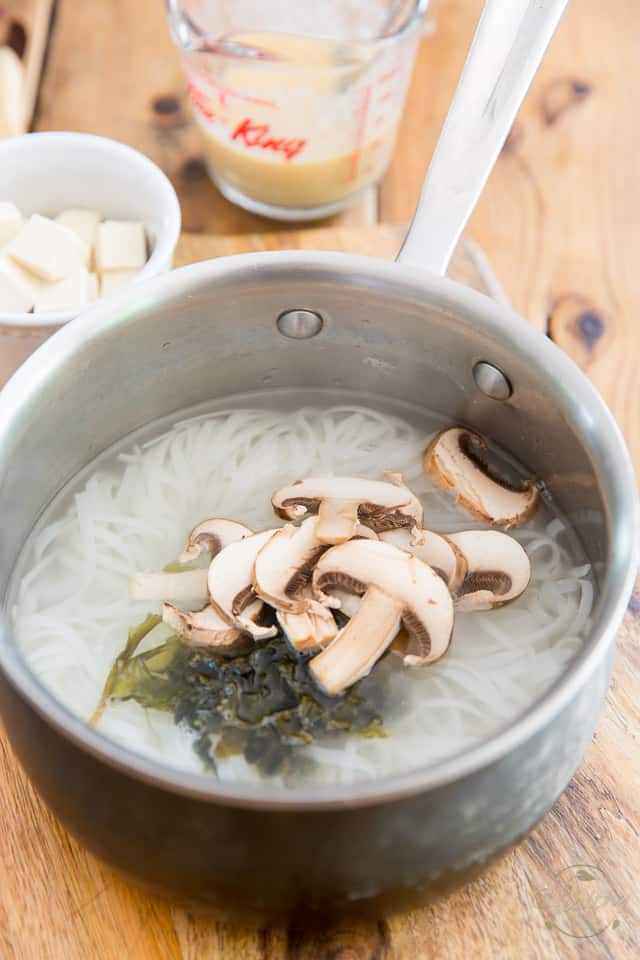 Add the mushrooms and wakame to the soup