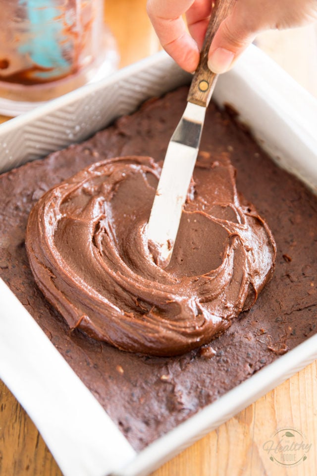 Dump frosting over the cooled brownies and spread