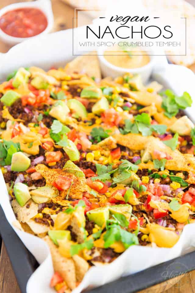 Spicy crumbled tempeh, loads of veggies and warm cashew queso scattered over a bed of organic corn tortilla chips... These Vegan Nachos with Spicy Crumbled Tempeh are the ultimate party food made good for you! 