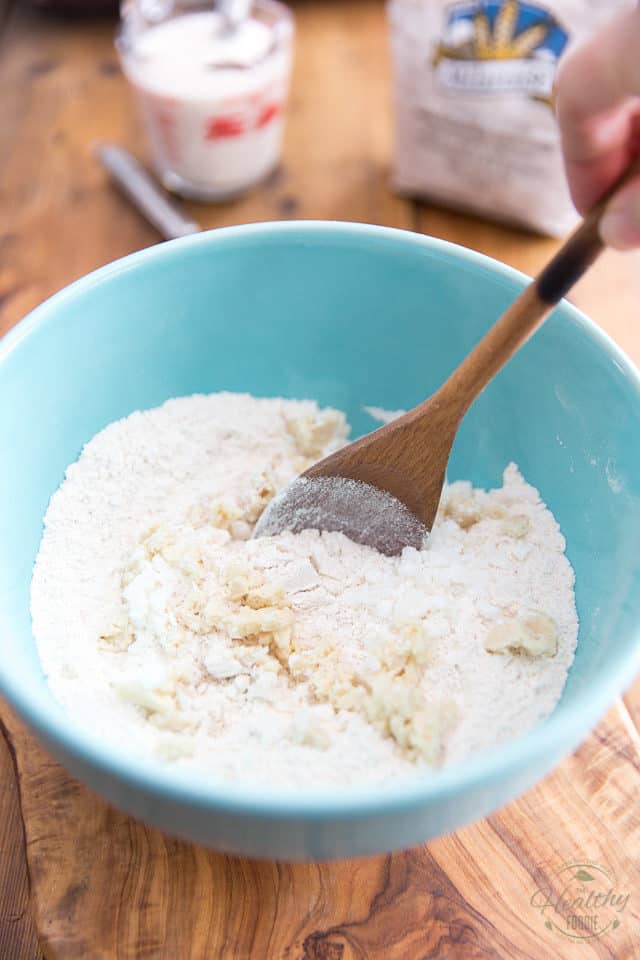 Add the cold, finely chopped fats to the flour mixture and mix well with a wooden spoon or rubber spatula