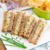 These Creamy Vegan Egg Salad Party Sandwiches look and taste so much like the real deal, no one will ever notice if you just drop them on the table without saying a word...