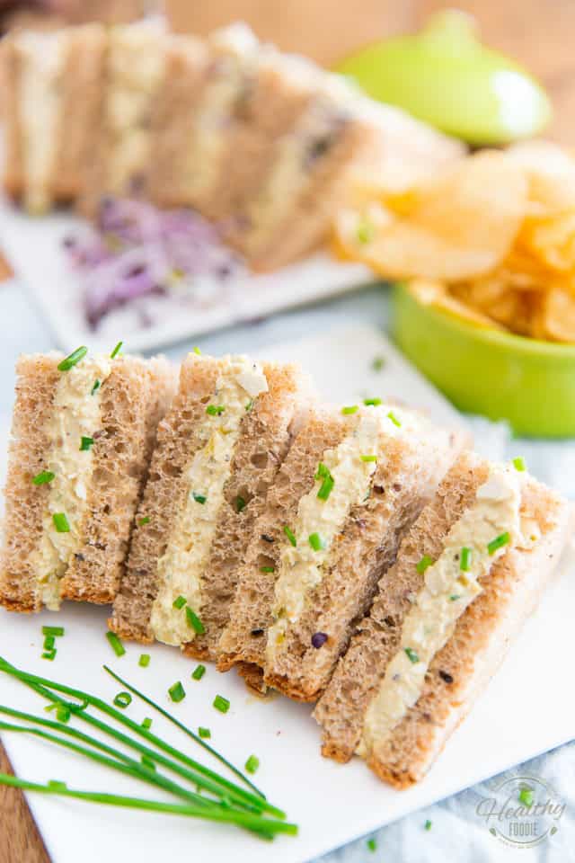 These Vegan Creamy Egg Salad Party Sandwiches look and taste so much like the real deal, no one will ever notice if you just drop them on the table without saying a word...
