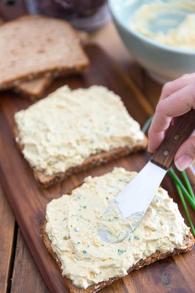 Spread the egg salad onto 4 slices of bread