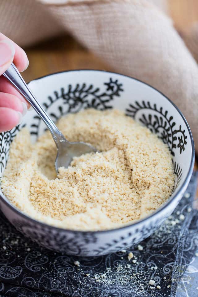 This 5 ingredient Vegan Parmesan only takes 2 minutes to make, and it's so crazy tasty, you'll want to sprinkle it on everything! Think "nooch" to the 10th power!