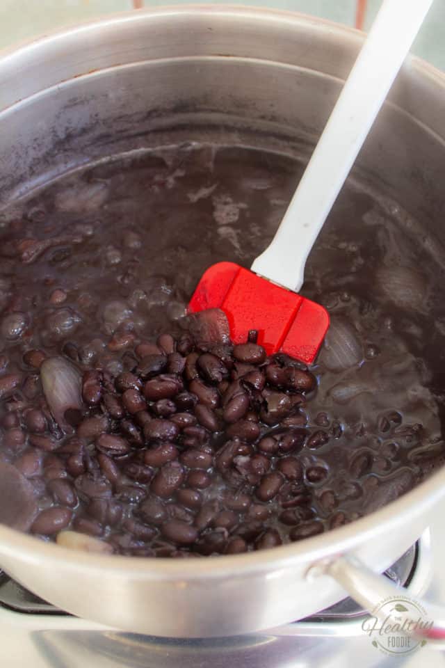 Cook until the beans are tender and the liquid just barely covers them