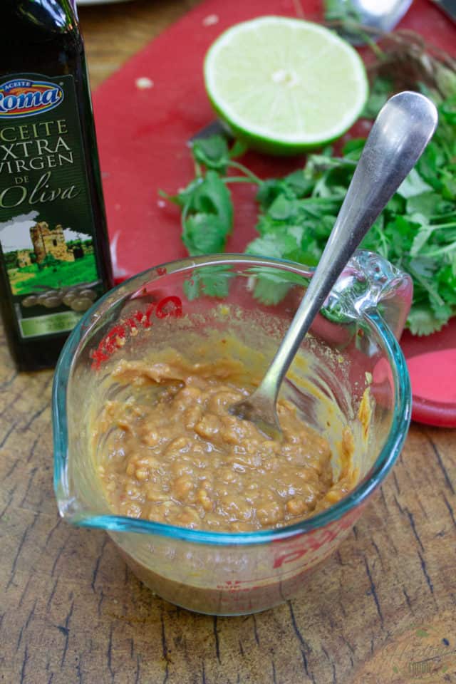 Partly finished peanut sauce in a glass measuring cup