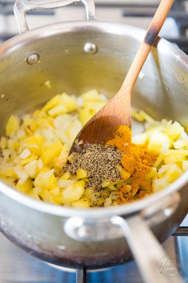 Add the turmeric, salt and pepper to the pot with the vegetables