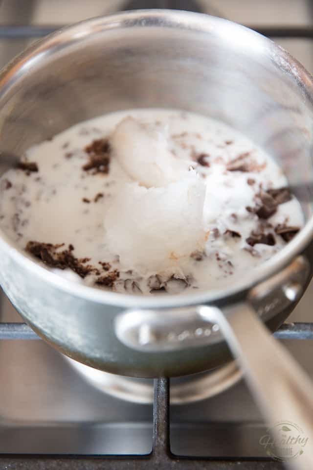 Combine the coconut oil, coconut milk and chopped chocolate into a small saucepan set over low heat
